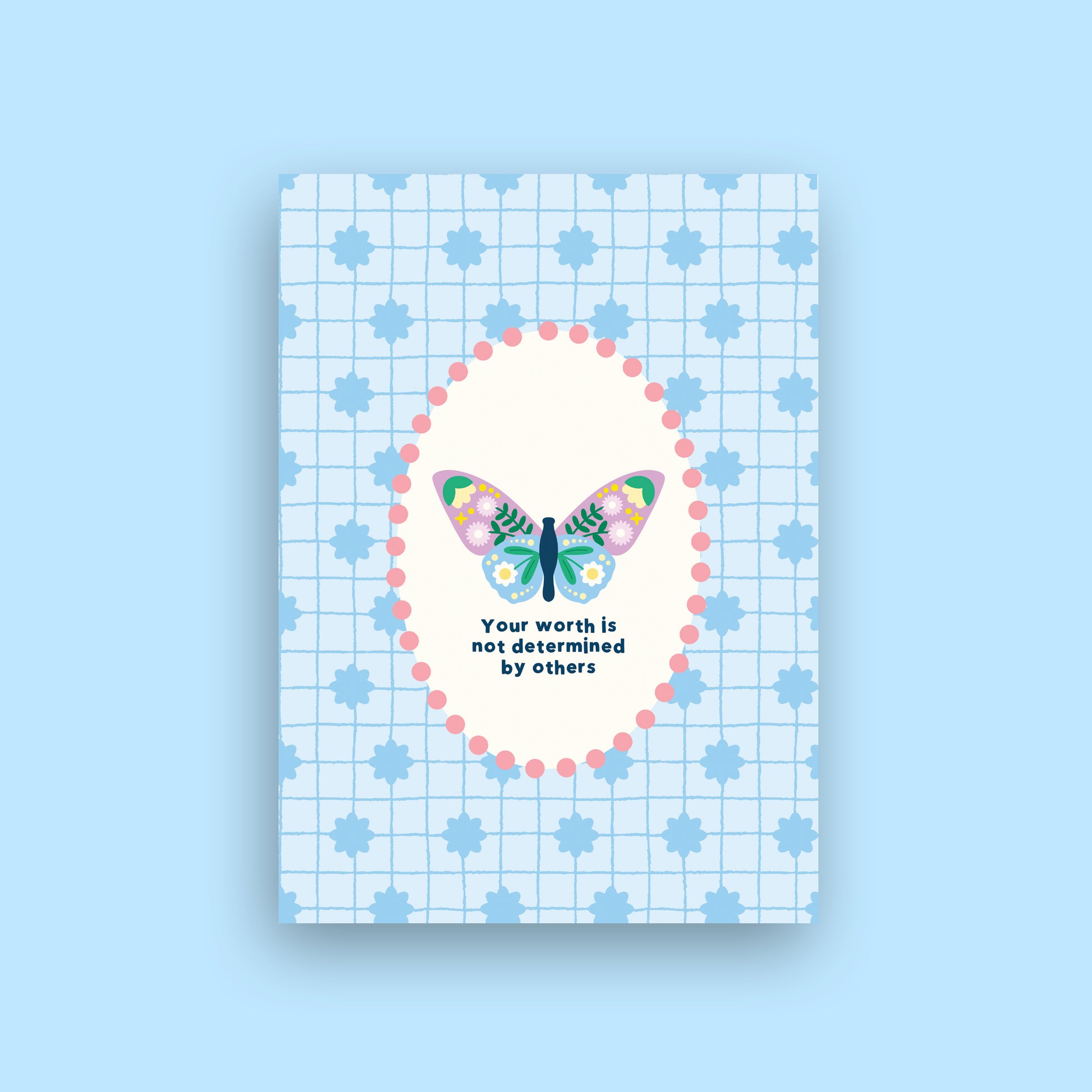 A square art print or card featuring a pastel butterfly illustration inside a pink dotted oval, with the text 'Your worth is not determined by others' on a light blue grid background with blue star motifs. The print is centered on a solid light blue background.